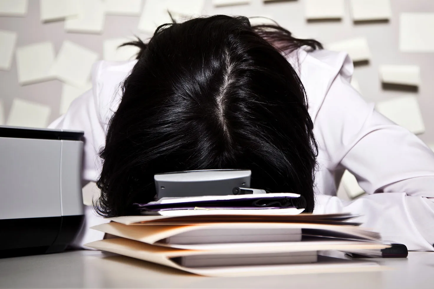 A business woman frustrated with her work
