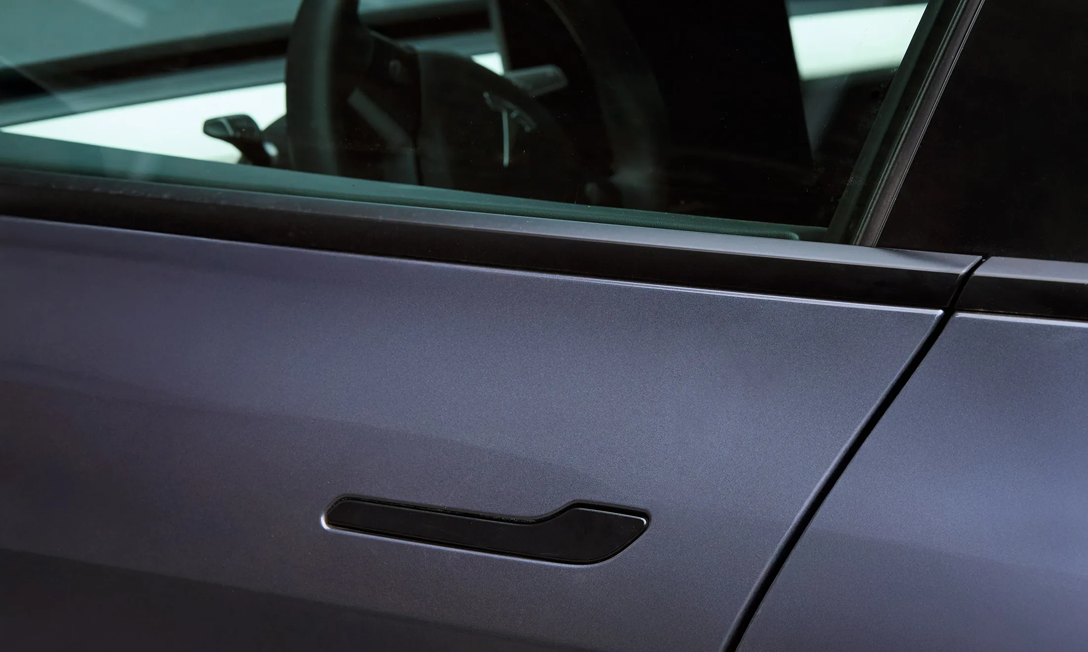 The exterior handle of a Tesla Model Y.