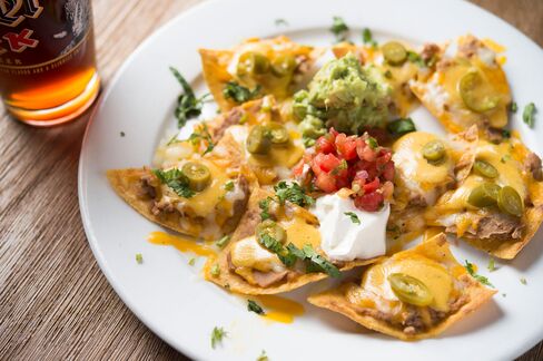 Individually stacked nachos at Javelina, where each chip is allotted its own personal toppings.