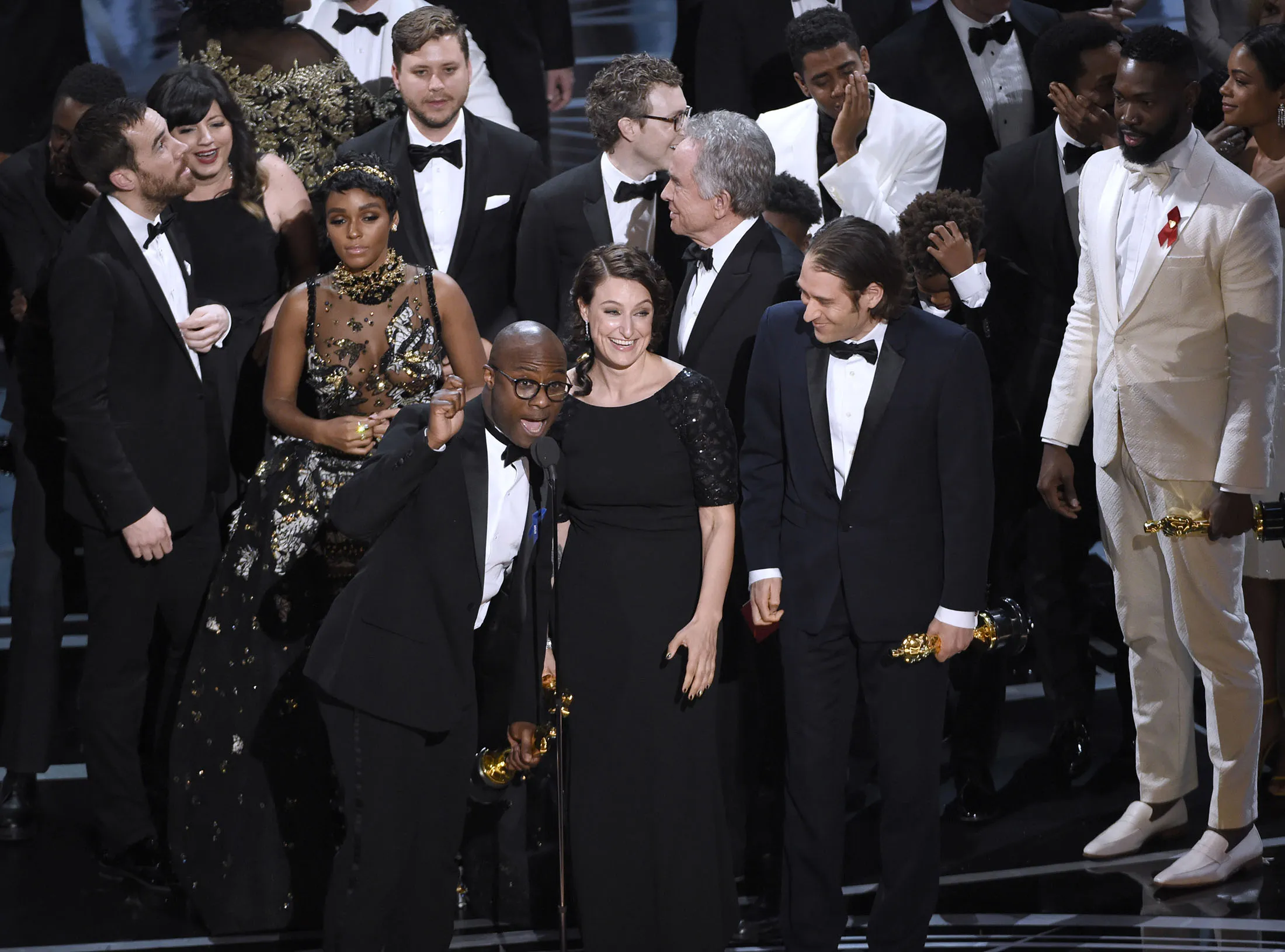 Barry Jenkins and the cast accept the award for best picture for 'Moonlight' at the Oscars in Los Angeles on Feb. 26, 2017.
