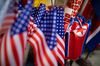 American, North Korean and Vietnamese national flags are displayed for sale at a store in Hanoi, Vietnam, on Sunday, Feb. 23, 2019. U.S. President Donald Trump and North Korean leader Kim Jong Un are scheduled to meet between Wednesday and Thursday in Hanoi for their second summit.