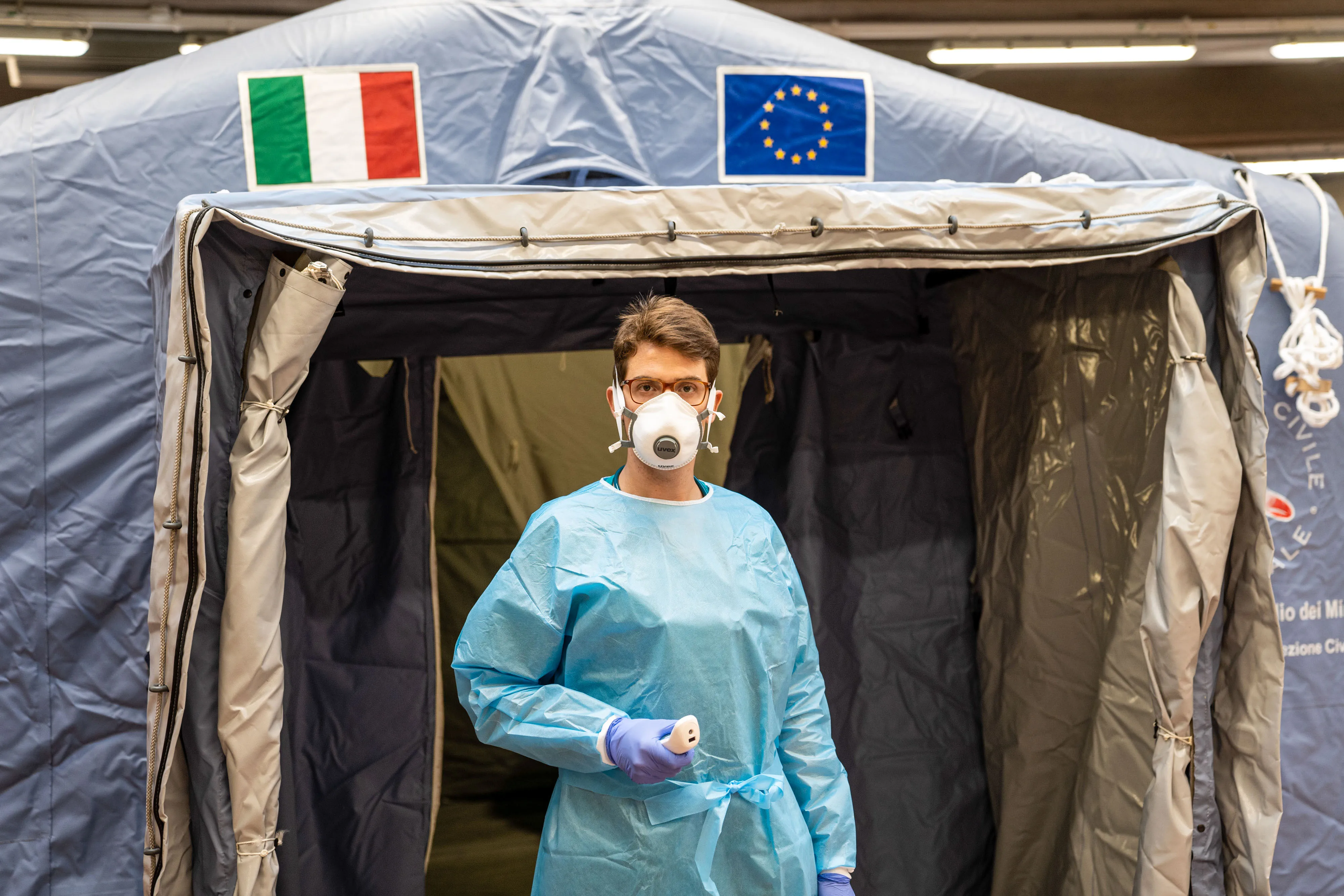 A medical worker stands at a triage center outside the emergency room in Molinette hospital in Turin.