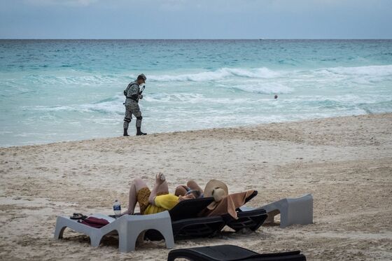 Sand and Soldiers Mix as Troops Move In to Protect Cancun Tourists