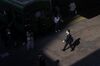 A pedestrian wearing a protective mask walks outside a train station in the Shibuya district of Tokyo, Japan.