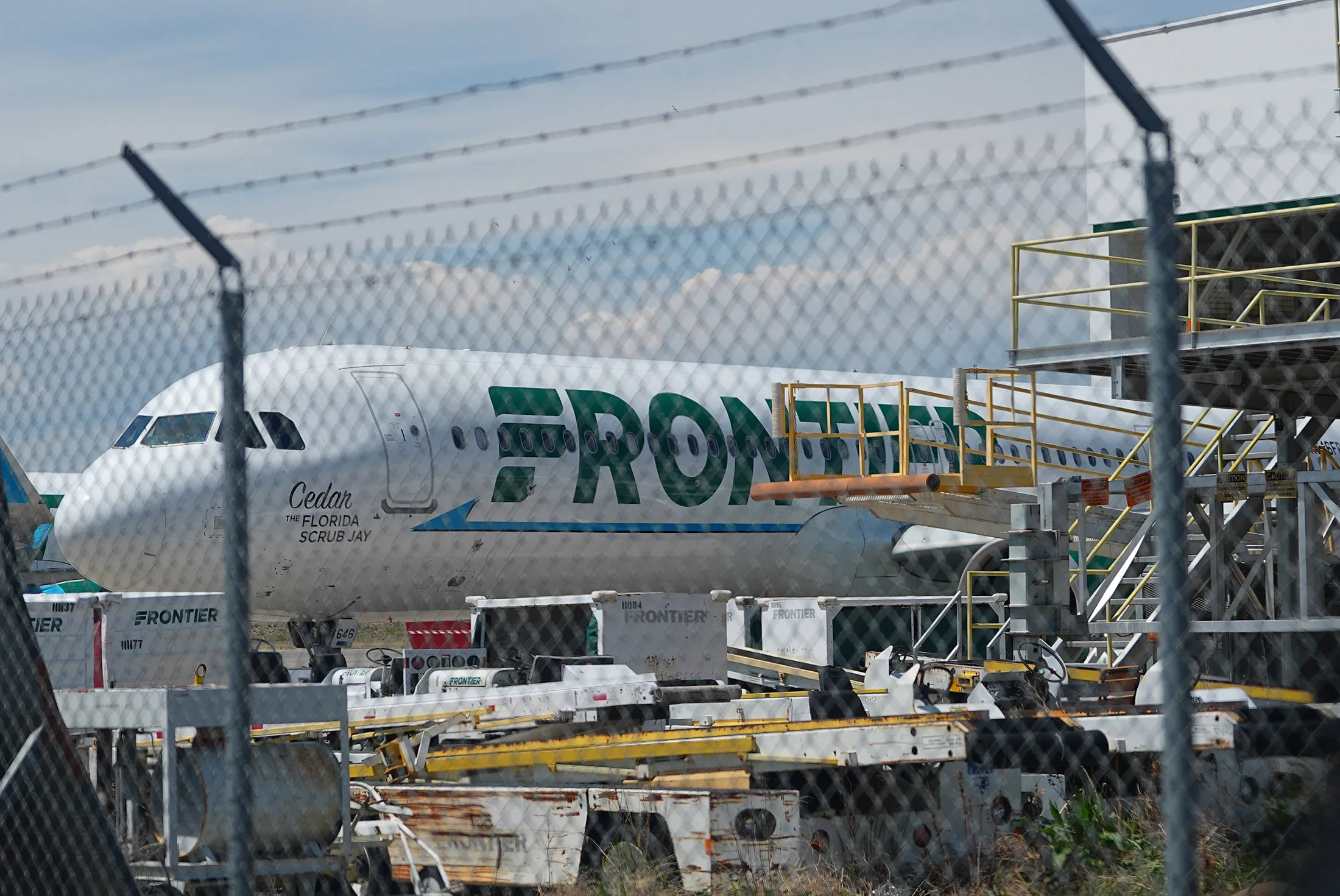 A Frontier Airlines passenger jet outside the technical operations center with other jetliners in for service north of Denver International Airport on May 9.
