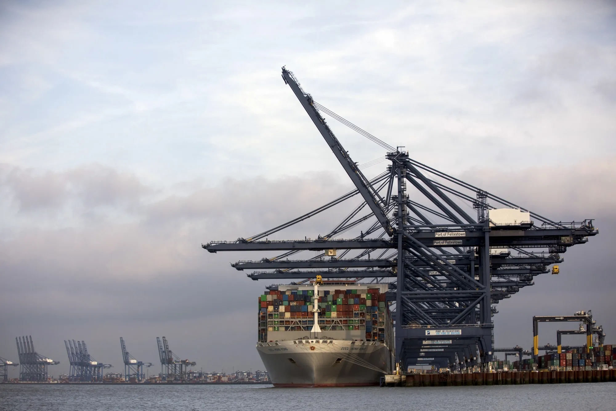 A container ship sits anchored dockside at the Port of Felixstowe,&nbsp;U.K.