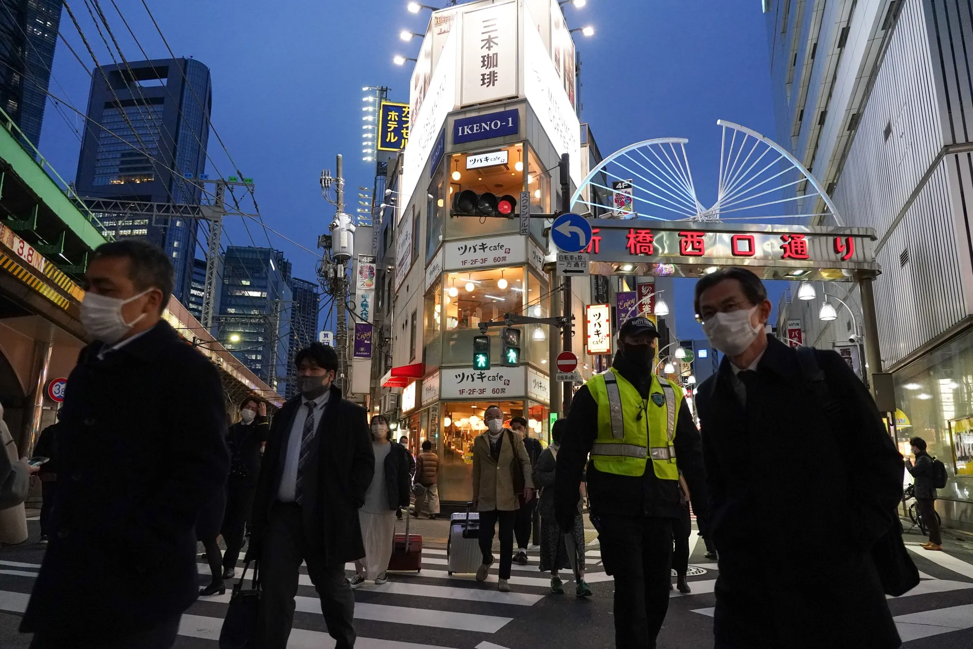 Pedestrians&nbsp;in the Shimbashi District of Tokyo on March 23.