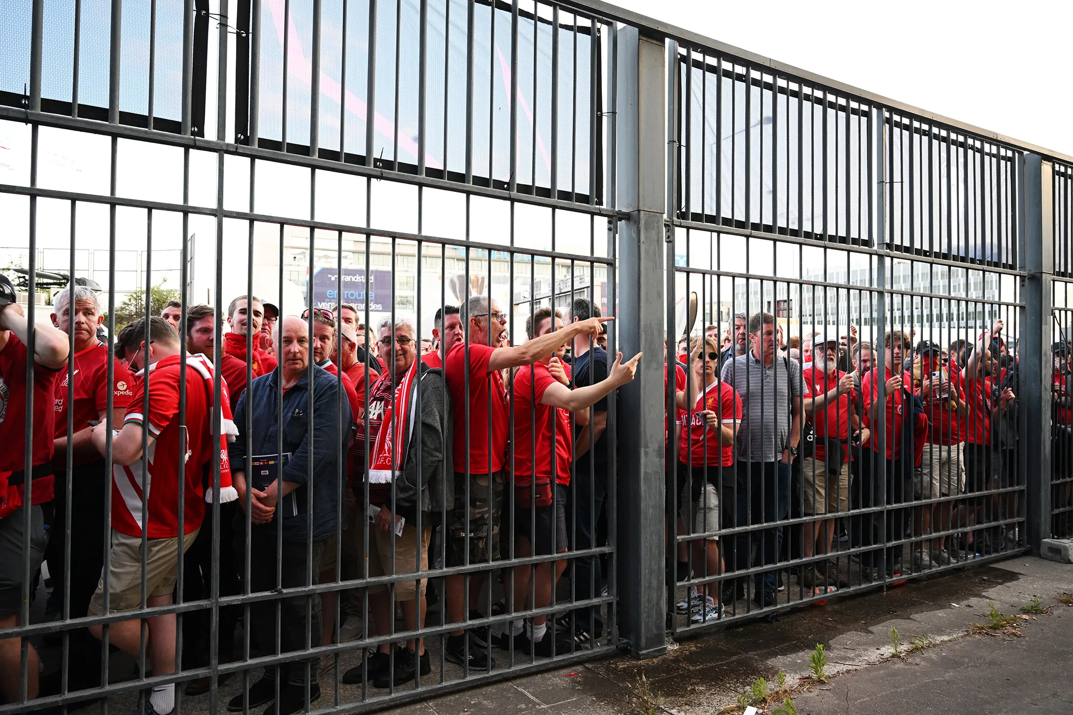 Liverpool fans react as they queue outside the stadium prior to the UEFA Champions League final match at Stade de France on May 28.