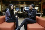 Aniyia Williams, founder and CEO of Tinsel, right, talks about program placement with Kara Lee, at the offices of Galvanize in San Francisco. Williams says she has made sure to hire women and underrepresented minorities.