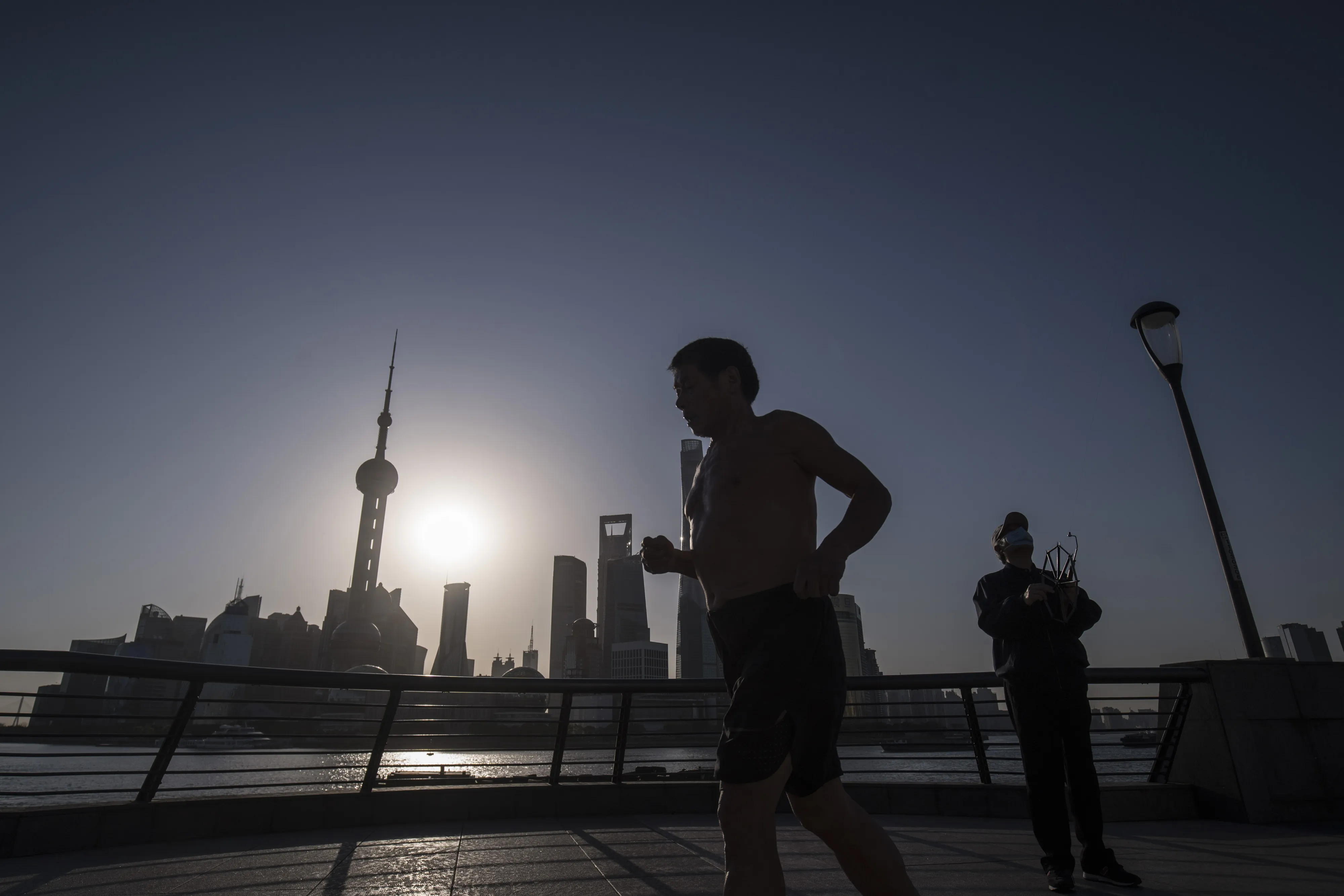 Office Workers in Shanghai as Premier Says Most of China Is Returning to Normal