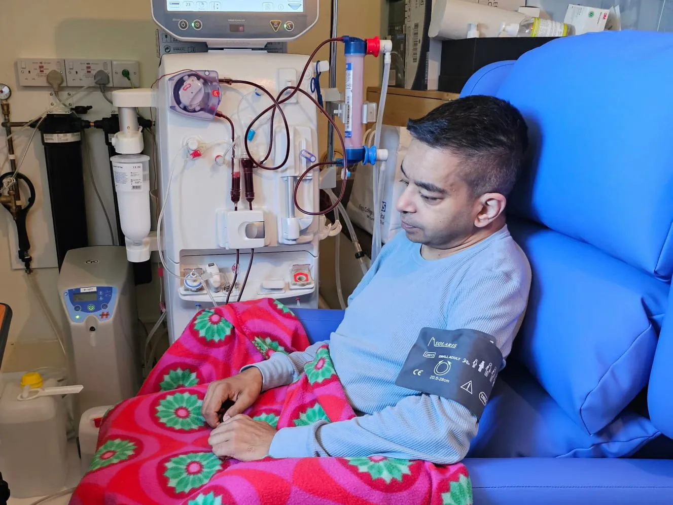Amit Sanchadev, whose only functioning kidney failed in 2016, plugs himself into his dialysis machine at home.