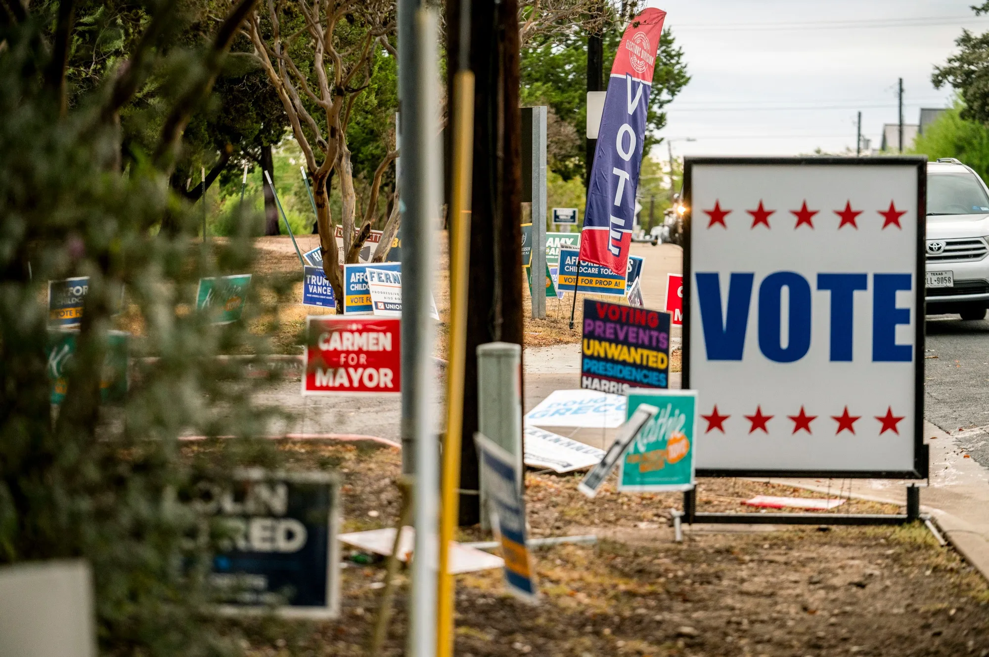 Campaign signs outside a polling location in Austin, Texas, in 2024.