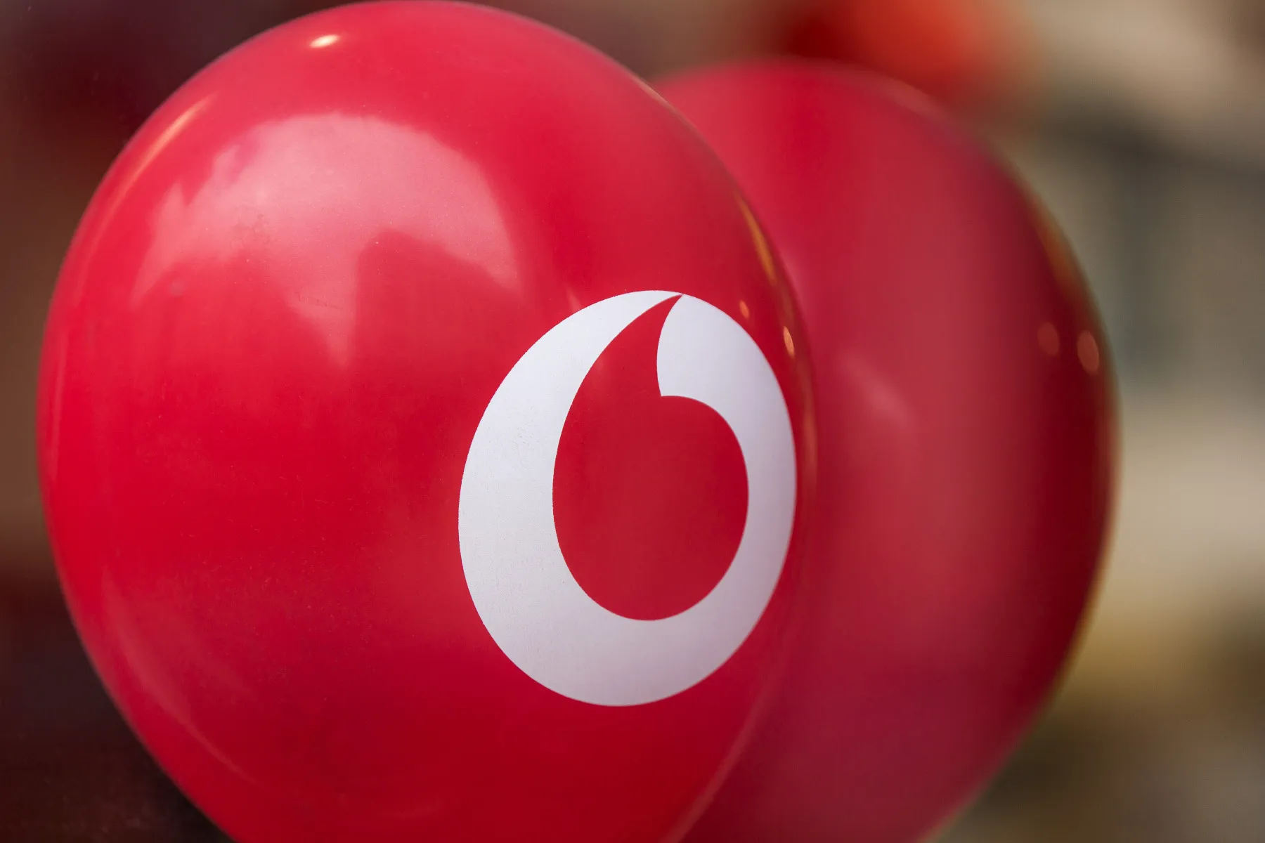 A Vodafone Group Plc logo.