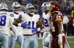 Dallas Cowboys outside linebacker Micah Parsons (11) celebrates in front of Washington Football Team running back Antonio Gibson (24) after sacking quarterback Taylor Heinicke (4) in the first half of an NFL football game in Arlington, Texas, Sunday, Dec. 26, 2021. (AP Photo/Roger Steinman)