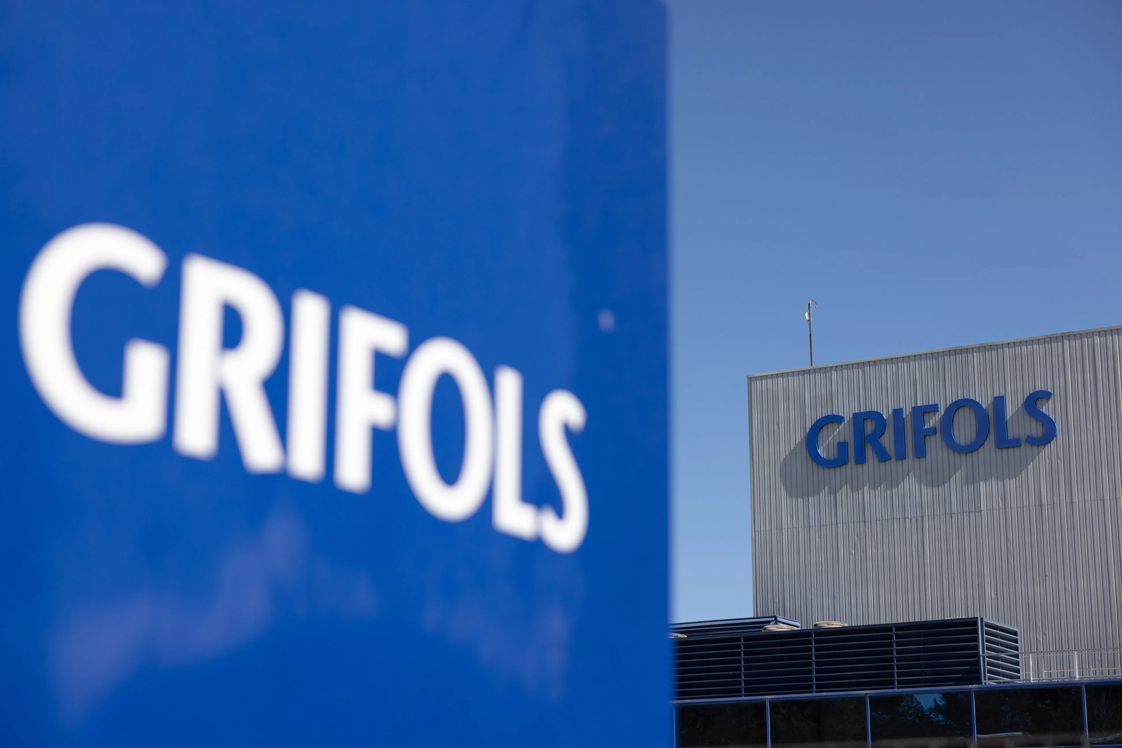 Signs on the exterior of a Grifols SA facility in Barcelona.