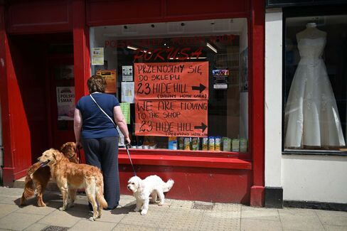 A woman looks in the window of a Polish shop in the centre of the border town of Berwick-upon-Tweed in northern England.