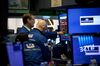 Traders work on the floor of the New York Stock Exchange (NYSE) in New York, U.S.