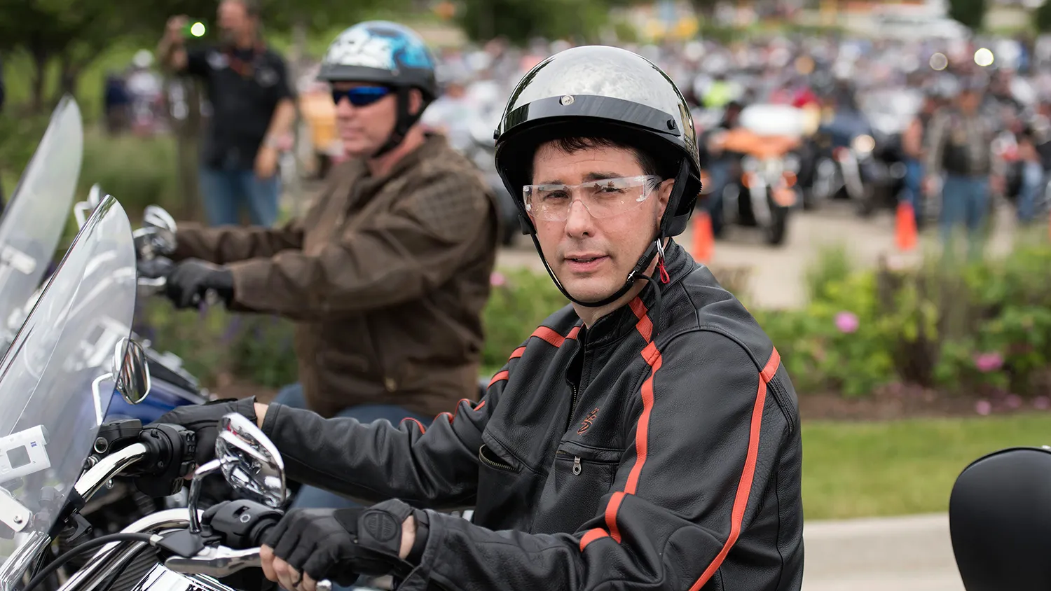 Scott Walker, governor of Wisconsin, sits on a Harley Davidson motorcycle as he awaits the start of a group ride at Big Barn Harley Davidson in Des Moines, Iowa, U.S., on Saturday, June 6, 2015.
