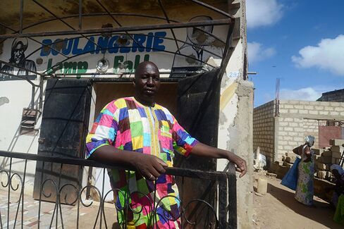 Ndiasse Dieng in front of his bakery in the city of Thies, Senegal.