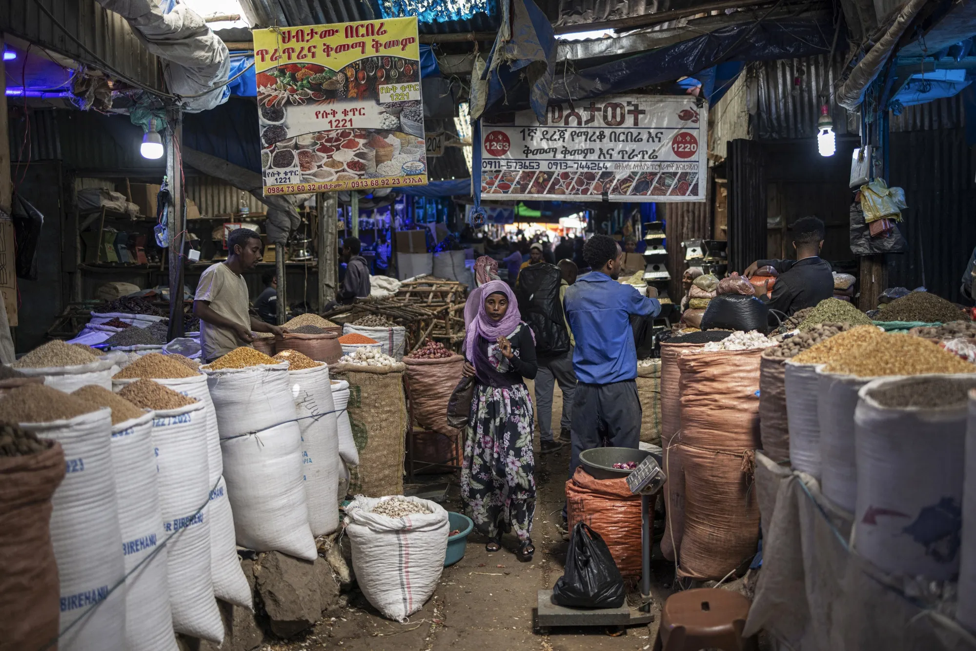 Shoppers walk through Shola market in Addis Ababa, Ethiopia.