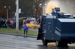 Police use water cannon to disperse demonstrators during a rally in Minsk on Oct. 11.