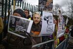 Supporters of Julian Assange demonstrate outside court prior to his extradition hearing in London on Feb. 25.