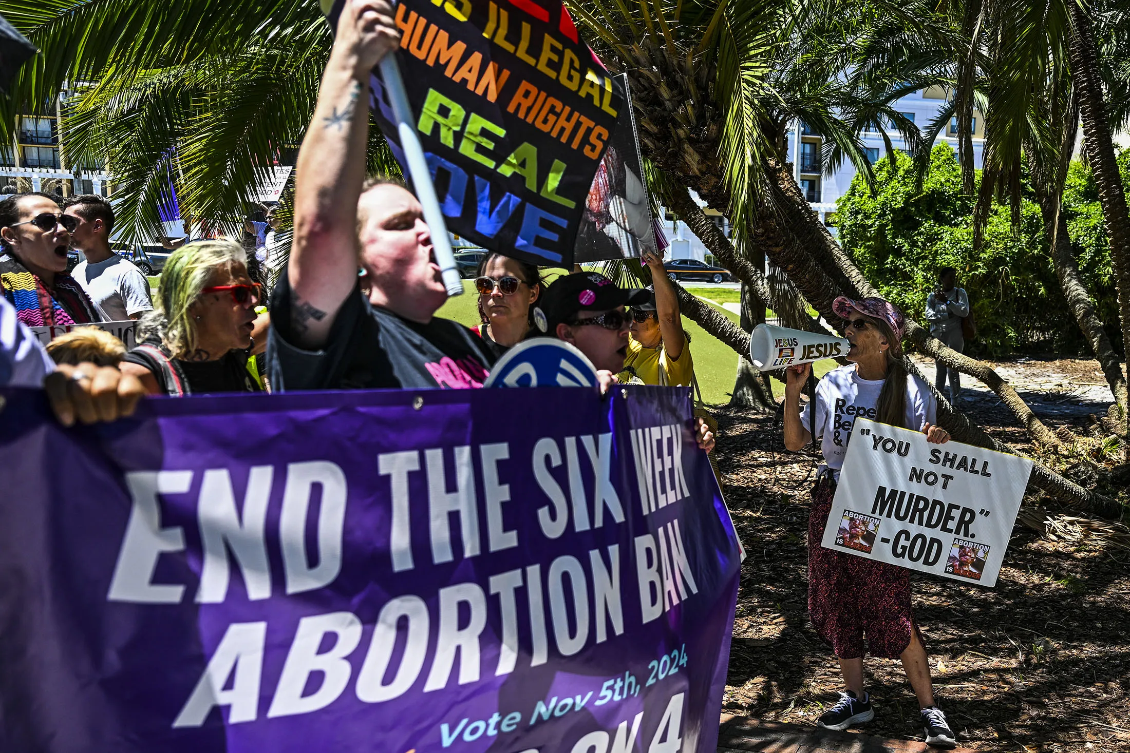 Anti-abortion activists, right, protest near the a pro-choice rally to protect abortion rights for Floridians, in Orlando, Florida, on April 13.