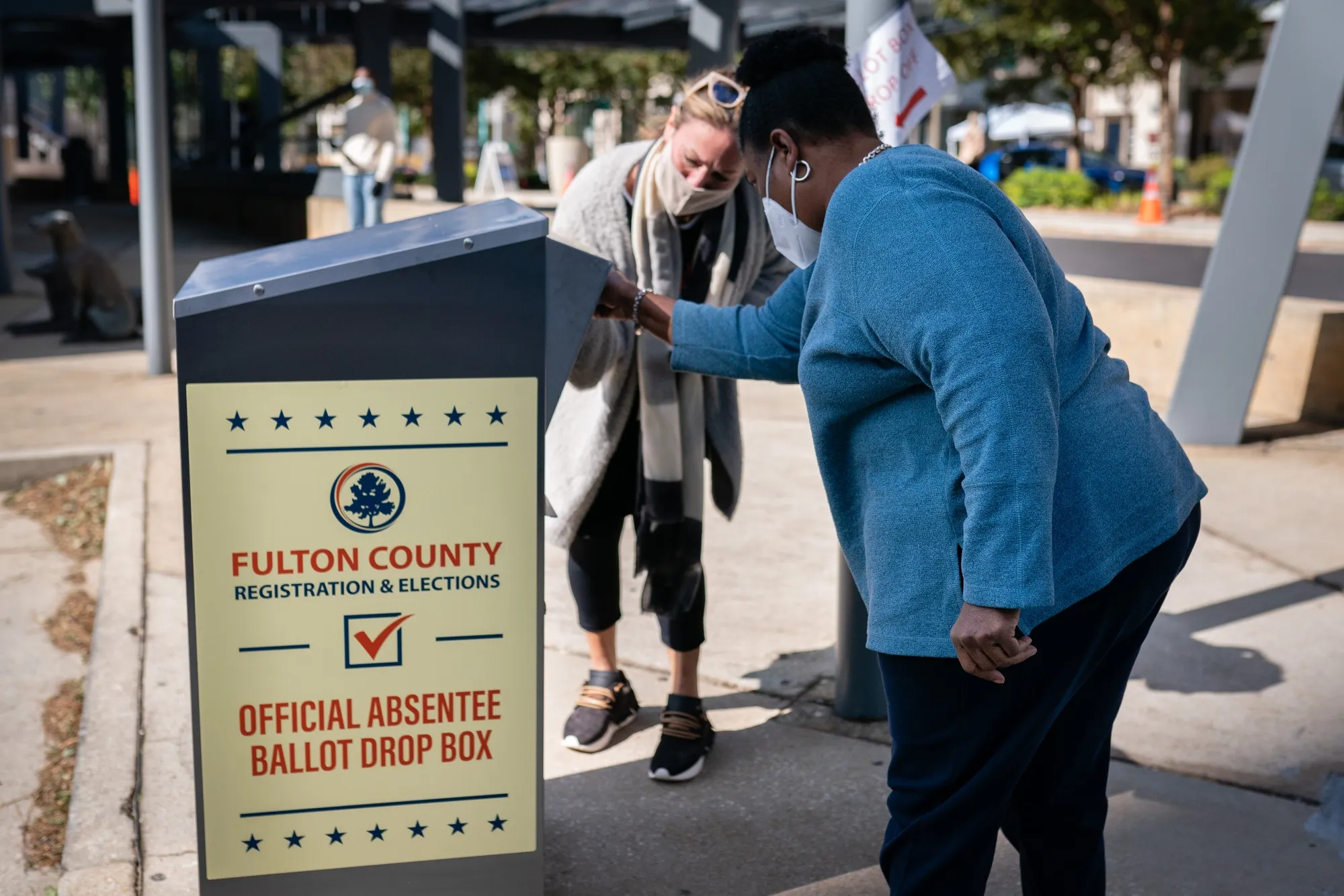 A voter drops off an absentee ballot in Atlanta, Georgia, on Nov. 3, 2020.