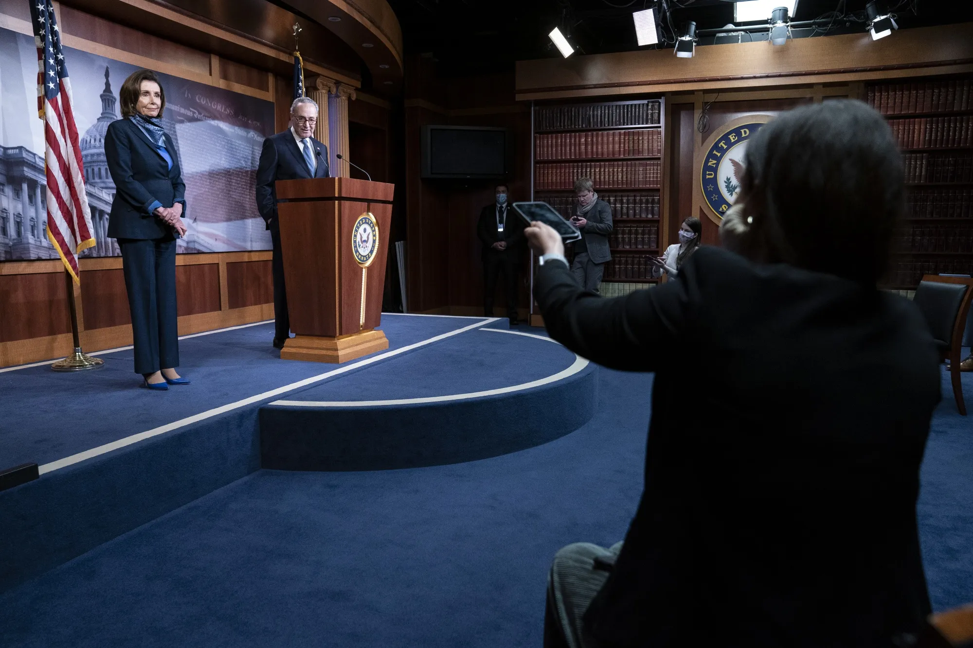 Chuck Schumer and Nancy Pelosi attend a news conference in Washington on April 21.