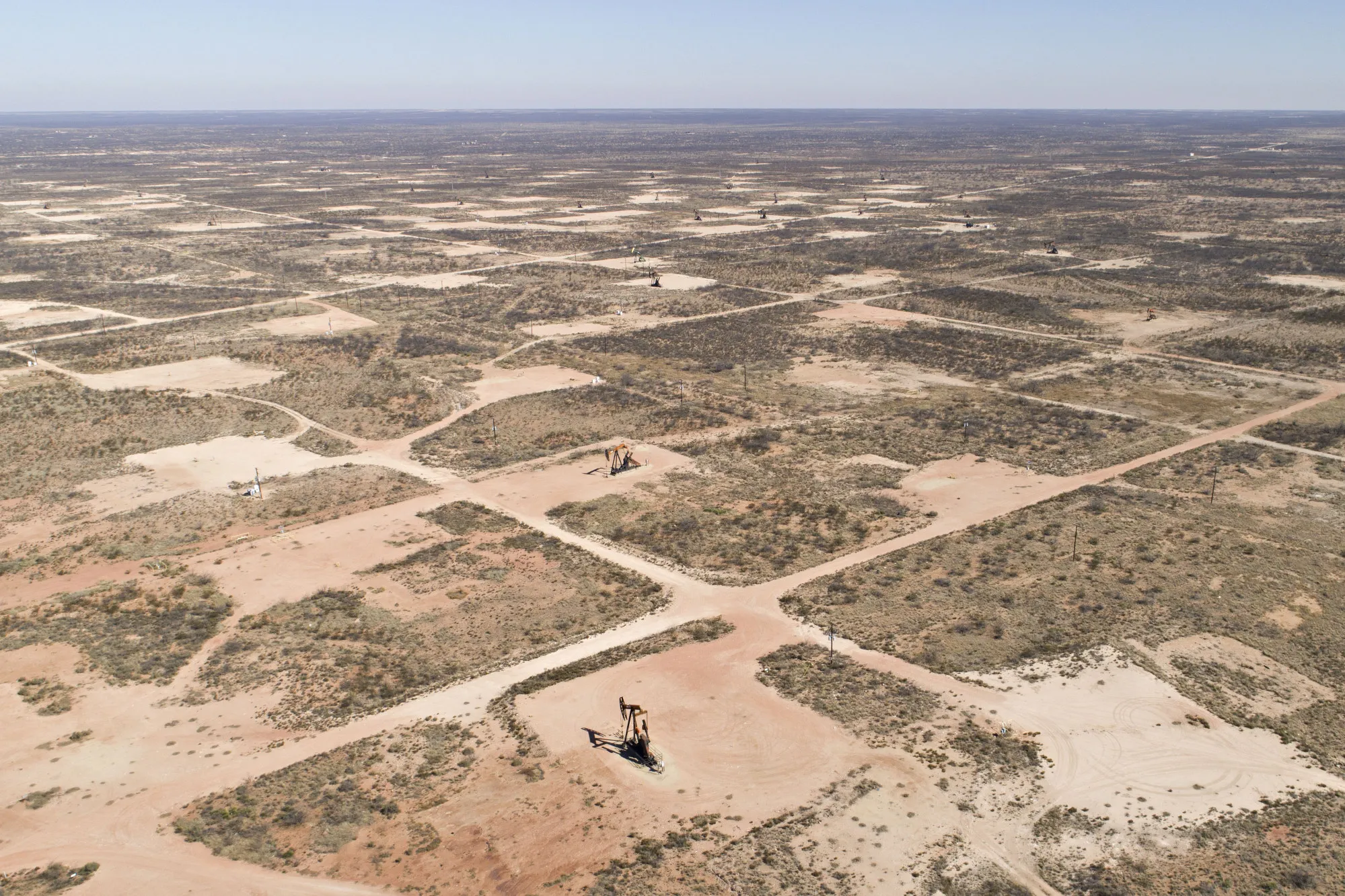 Pumpjacks operate on oil wells in the Permian Basin in Texas.