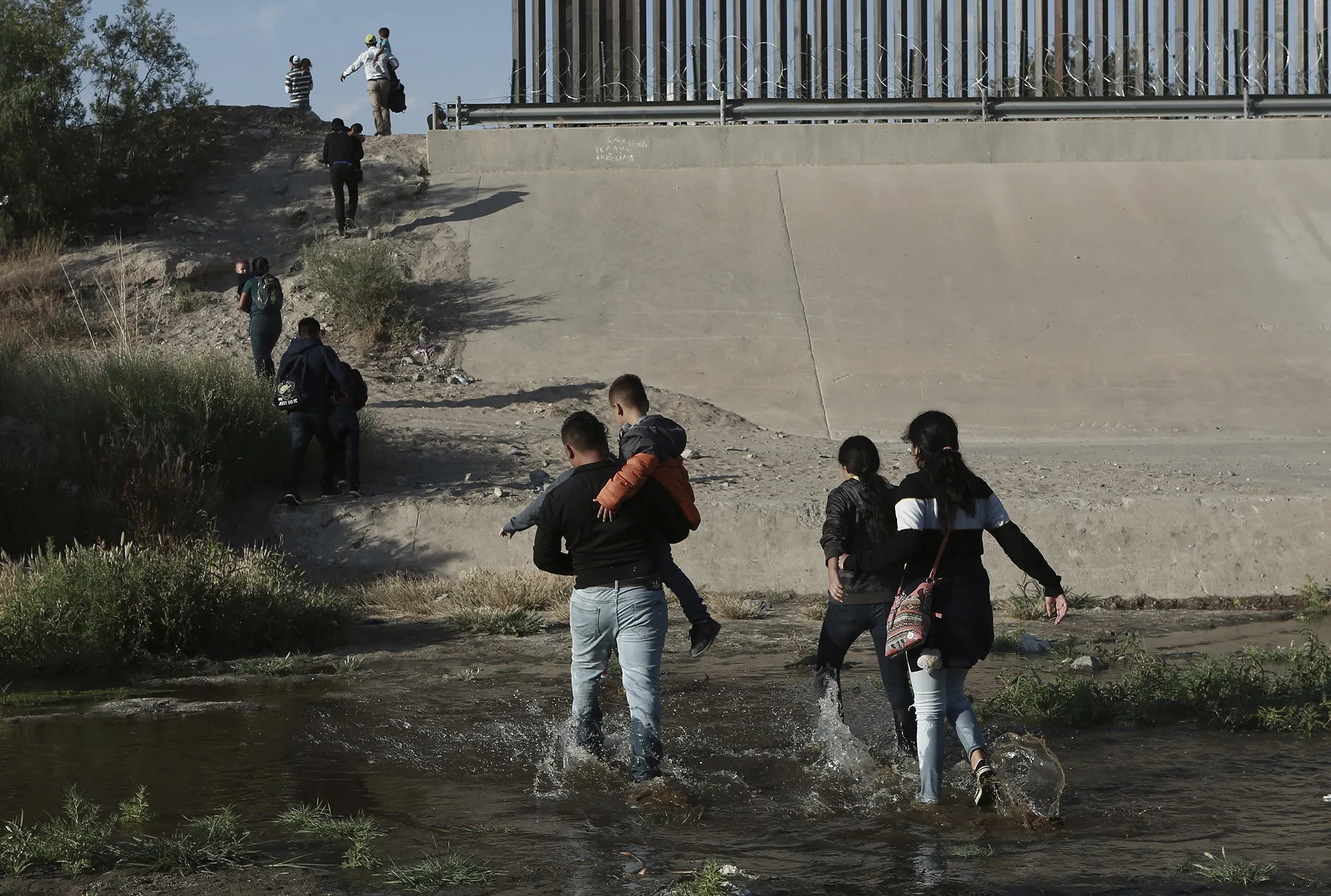 Migrants&nbsp;cross the Rio Grande to get across the border into the United States,&nbsp;near El Paso, Texas on May 31.