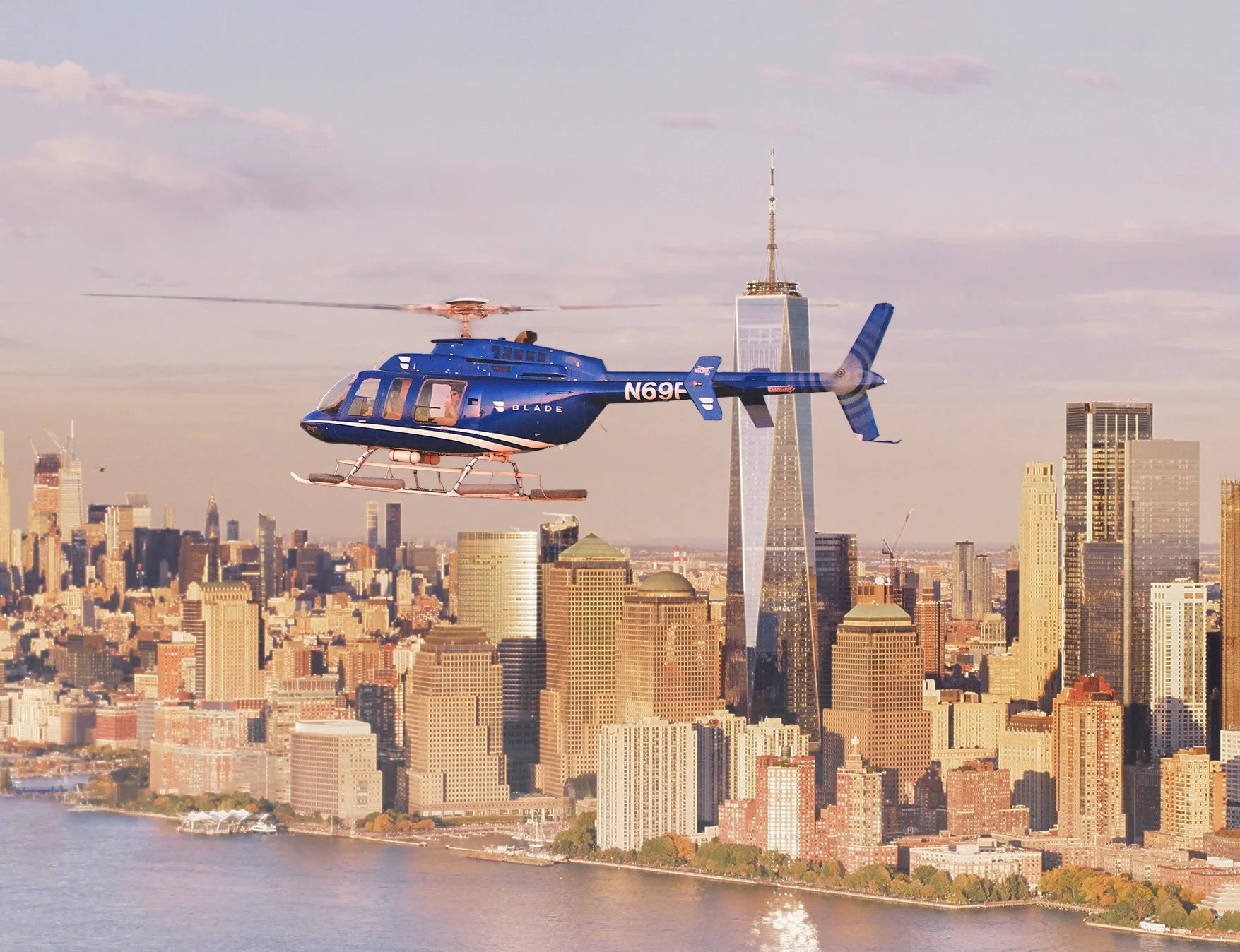 A Blade helicopter flies over New York City.