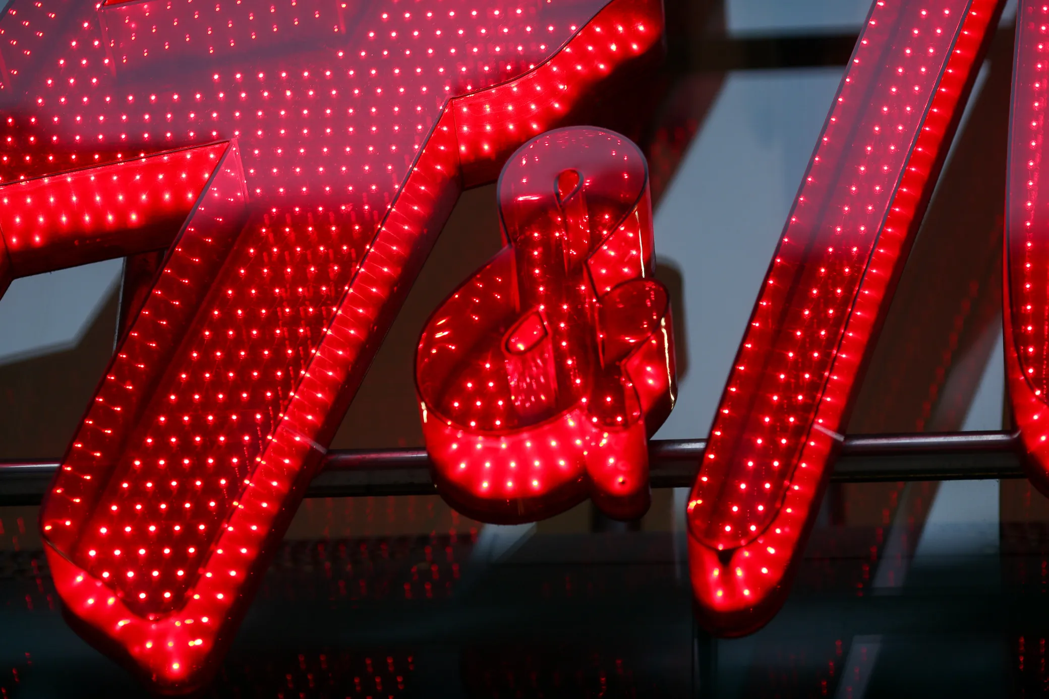 A sign hangs above the entrance to a H&M fashion clothing store, operated by Hennes and Mauritz AB, in London, U.K., on Friday, Oct. 16, 2015. Britain's inflation rate turned negative for only the second time since 1960 in September, reflecting weak price pressures that the Bank of England has warned will persist into 2016.