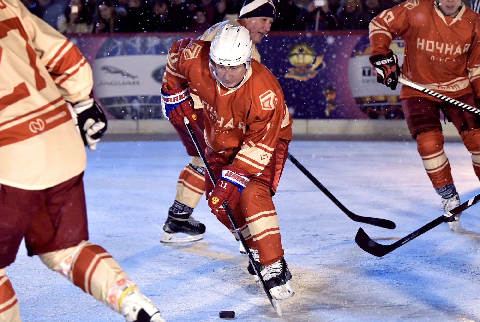 Russian President Vladimir Putin on the ice at a night hockey match in Moscow.