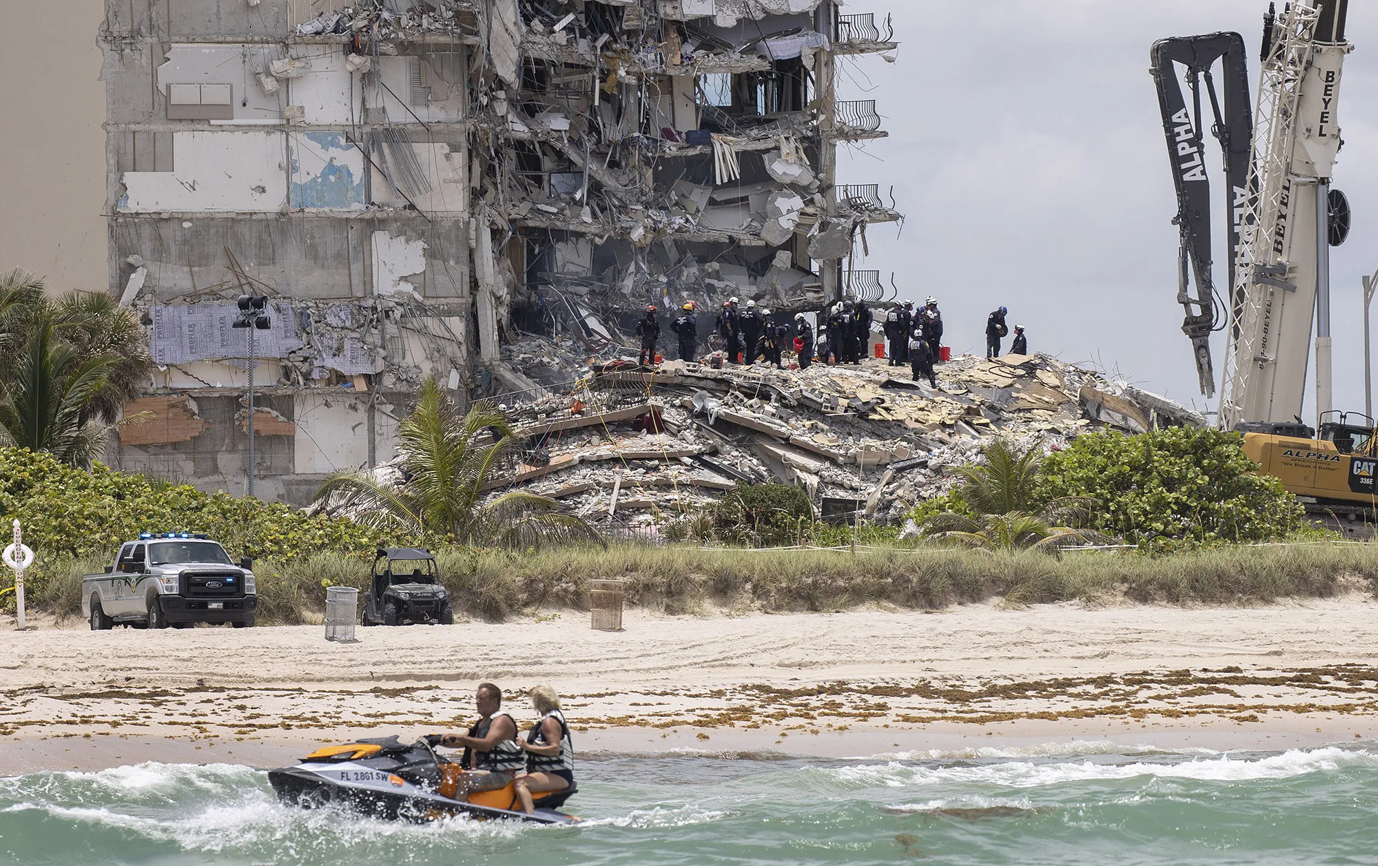 South Florida Urban Search and Rescue team look for possible survivors in the partially collapsed&nbsp;building on June 26.