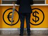 A man stands at a foreign currency exchange booth at a Commonwealth Bank of Australia branch in the central business district of Sydney, Australia, on Thursday, June 21, 2018. Australia is riding out a huge gamble on property. The bet: 27 years of recession-free economic growthduring which Sydney home prices surged fivefoldwould continue unabated and allow borrowers to keep servicing their debt.