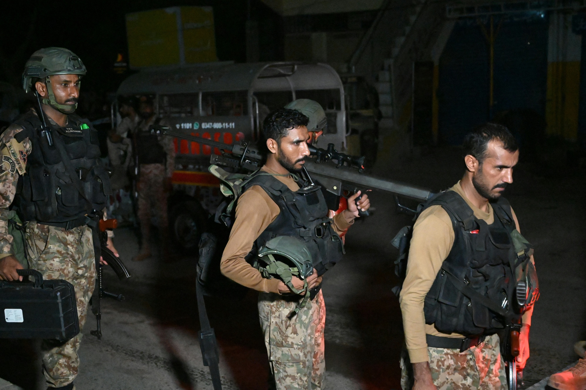Paramilitary soldiers return after completing an operation following a militant attack on Pakistan's Security Rangers compound in Karachi on June 28. Photographer: Rizwan Tabassum/AFP/Getty Images