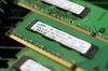 Samsung Electronics Co.'s 2 GB Double-Data-Rate (DDR) modules with memory chips are arranged for a photograph at an electronic store in Seoul, South Korea.