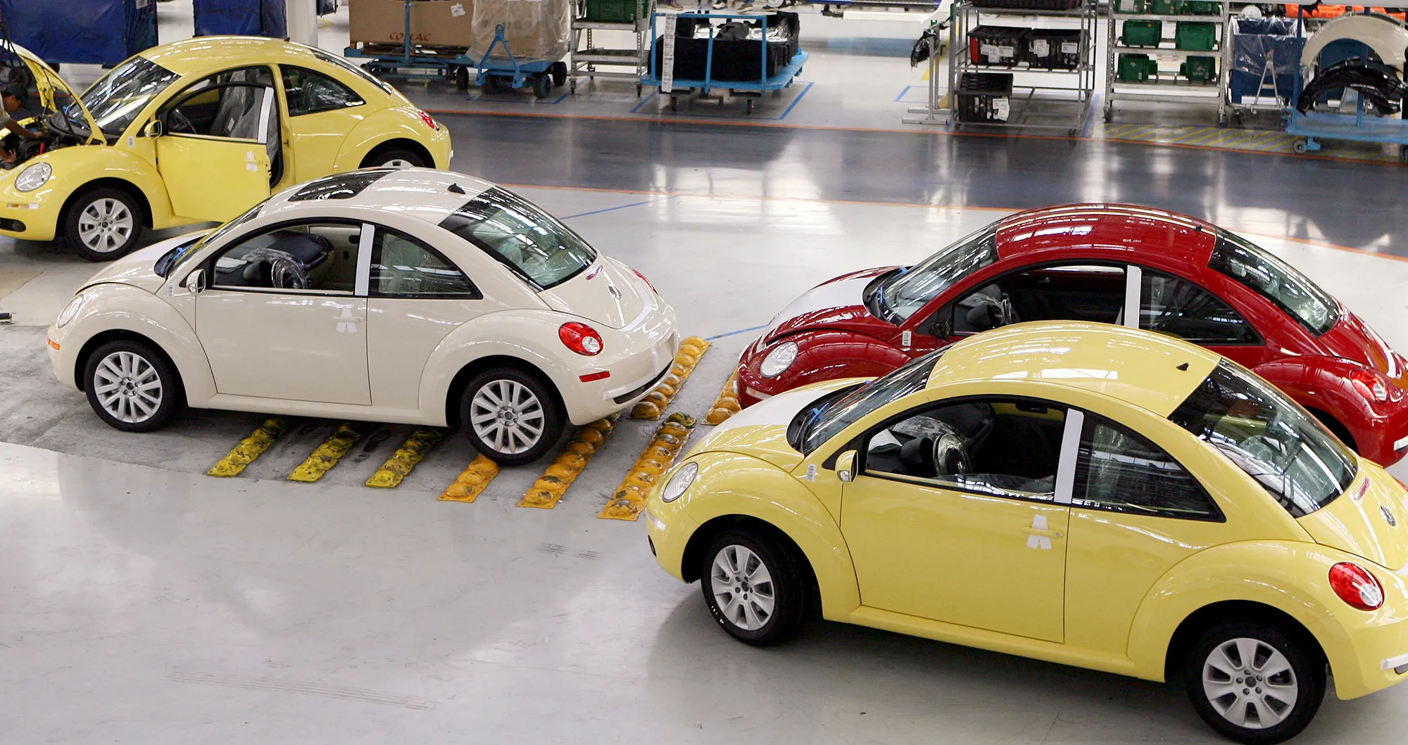 Volkswagen AG Beetle cars wait to be driven out of the Volkswagen AG plant in Puebla, Mexico.
