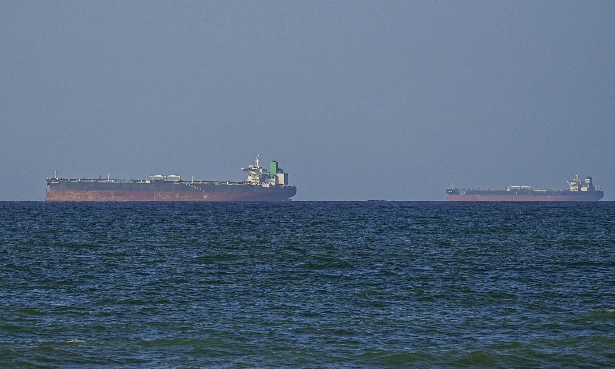 A view of the vessels passing through Strait of Hormuz following the two-week temporary ceasefire reached between the United States and Iran on the condition that the strait be reopened, seen in Oman on April 08, 2026.