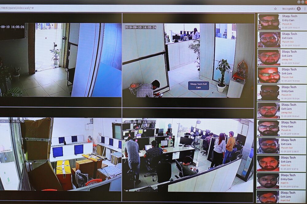 Employees displays a facial recognition identity system installed / acquired by various security agencies of India developed by the  security system solution developer Staqu's at its headquarters  in Gurugram, Haryana, on the outskirts of New Delhi, India