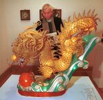 Thomas Tang, of Edgewater, NJ, examines a Golden Dragon lantern made by an unidentified artist at the Chinese Cultural Center  Gallery in New York City on February 4, 2000. The Chinese Year of the Dragon begins Saturday, February 5, 2000.
