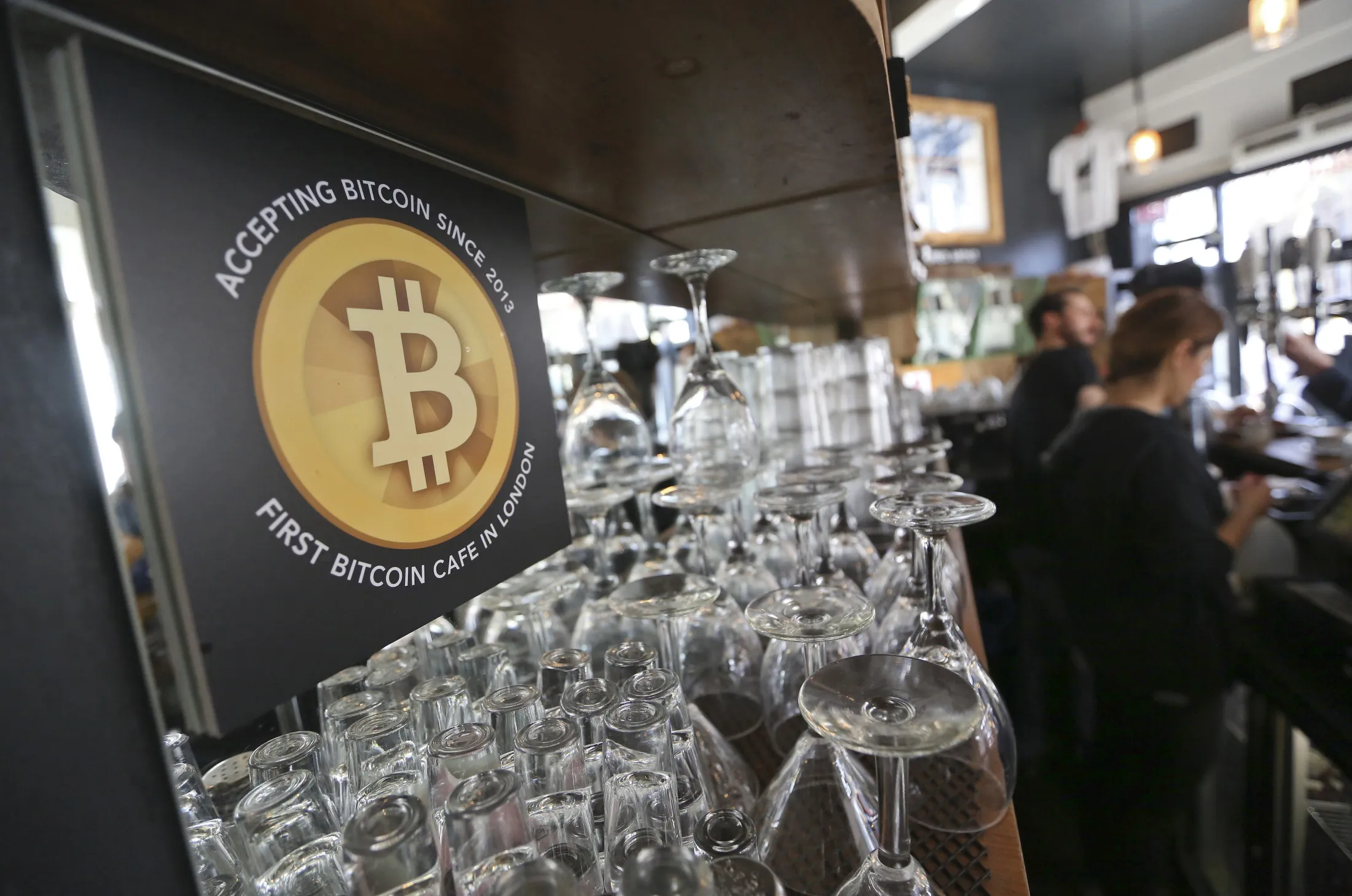A poster alerting customers that Bitcoin is accepted at a cafe in London.