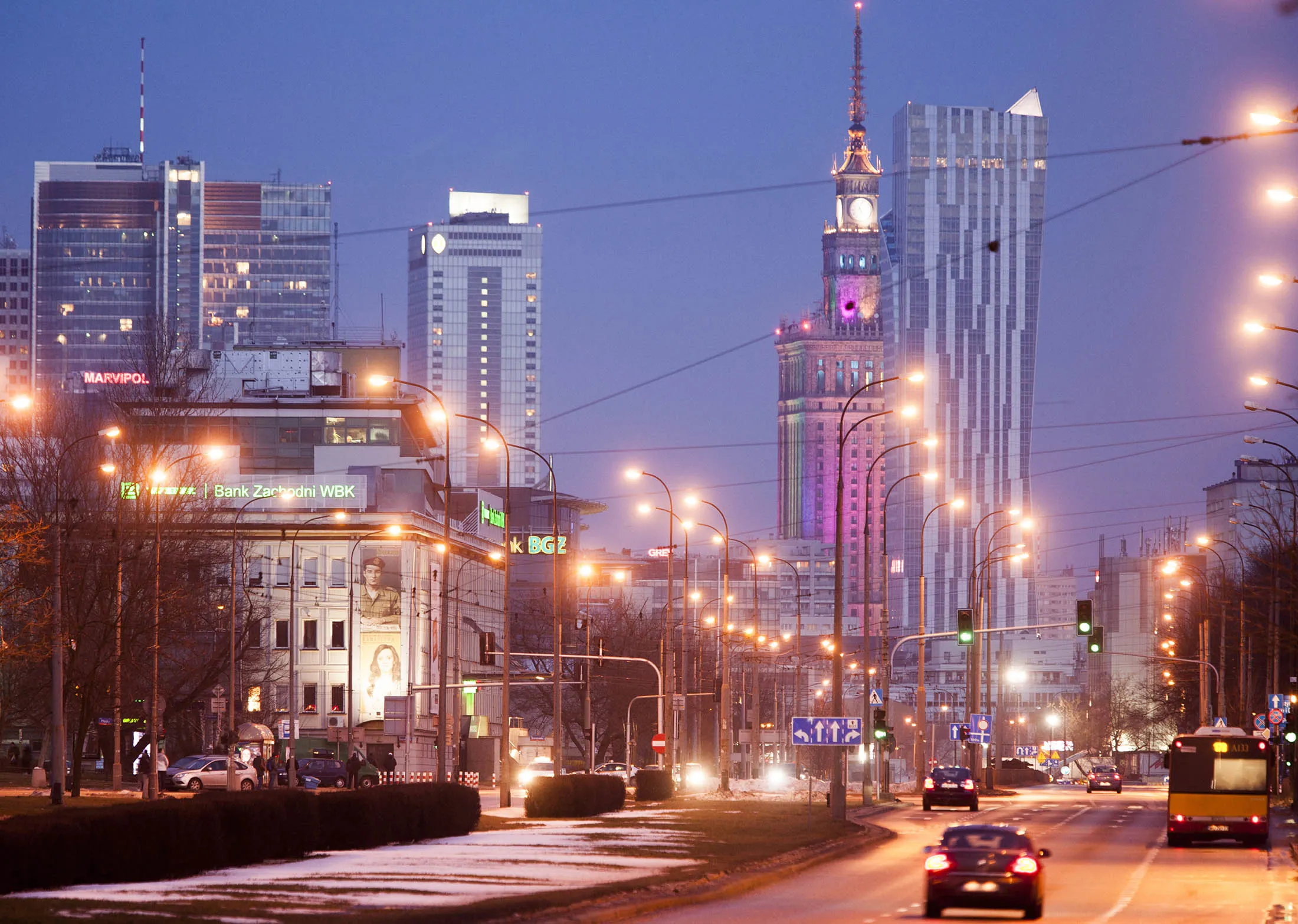 City skyscrapers stand illuminated at evening on the city skyline in Warsaw, Poland, on Saturday, Feb. 8, 2014. Poland is overhauling regulations governing mortgage-backed securities in a bid to boost issuance and increase bank access to longer-term financing.
