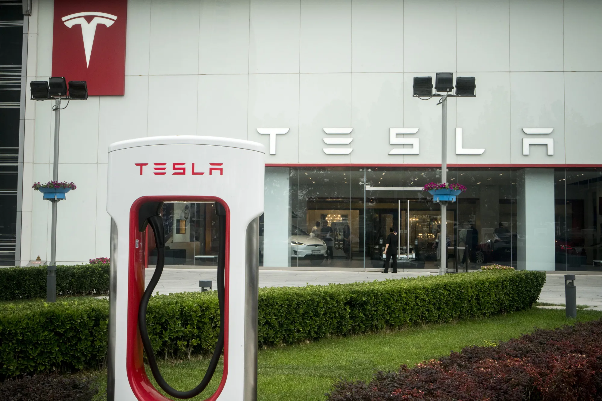 A Tesla supercharger station in front of the company's showroom in Beijing.