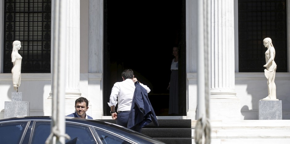 Greek Prime Minister Alexis Tsipras arrives at his office in Maximos Mansion in Athens on July 13.