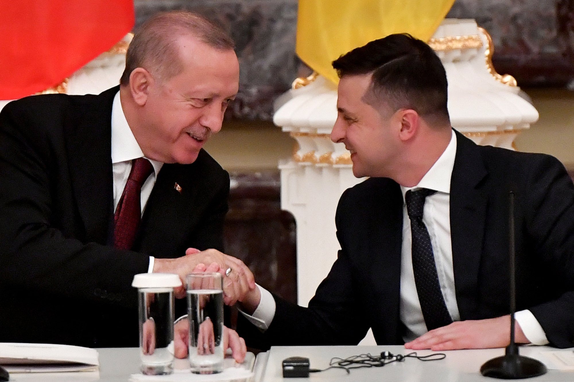 Volodymyr Zelensky and Recep Tayyip Erdogan shake hands in Kiev in February 2020.&nbsp;