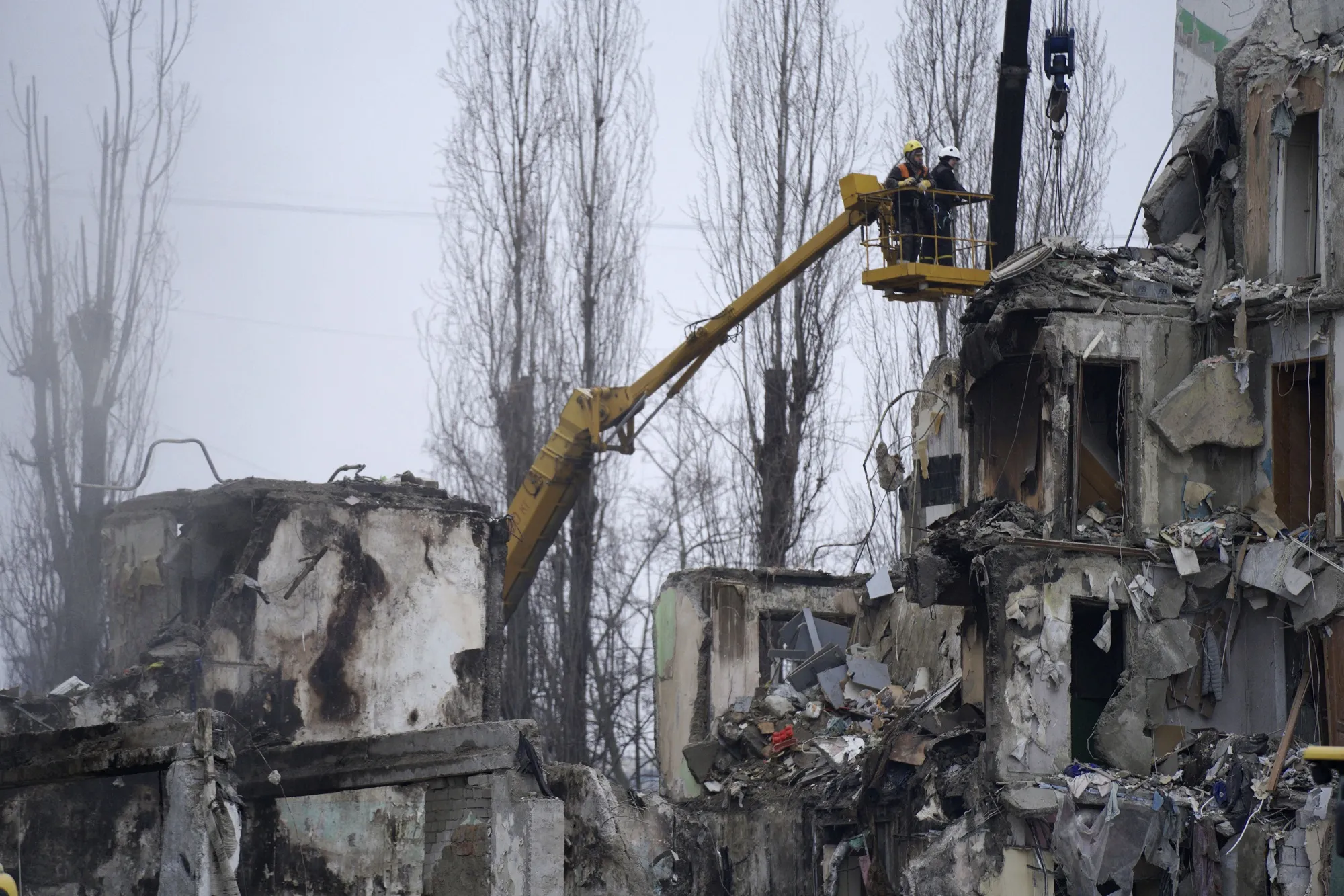 Rescuers work on a residential building destroyed after a missile strike, in Dnipro, Ukraine, on Jan. 16.