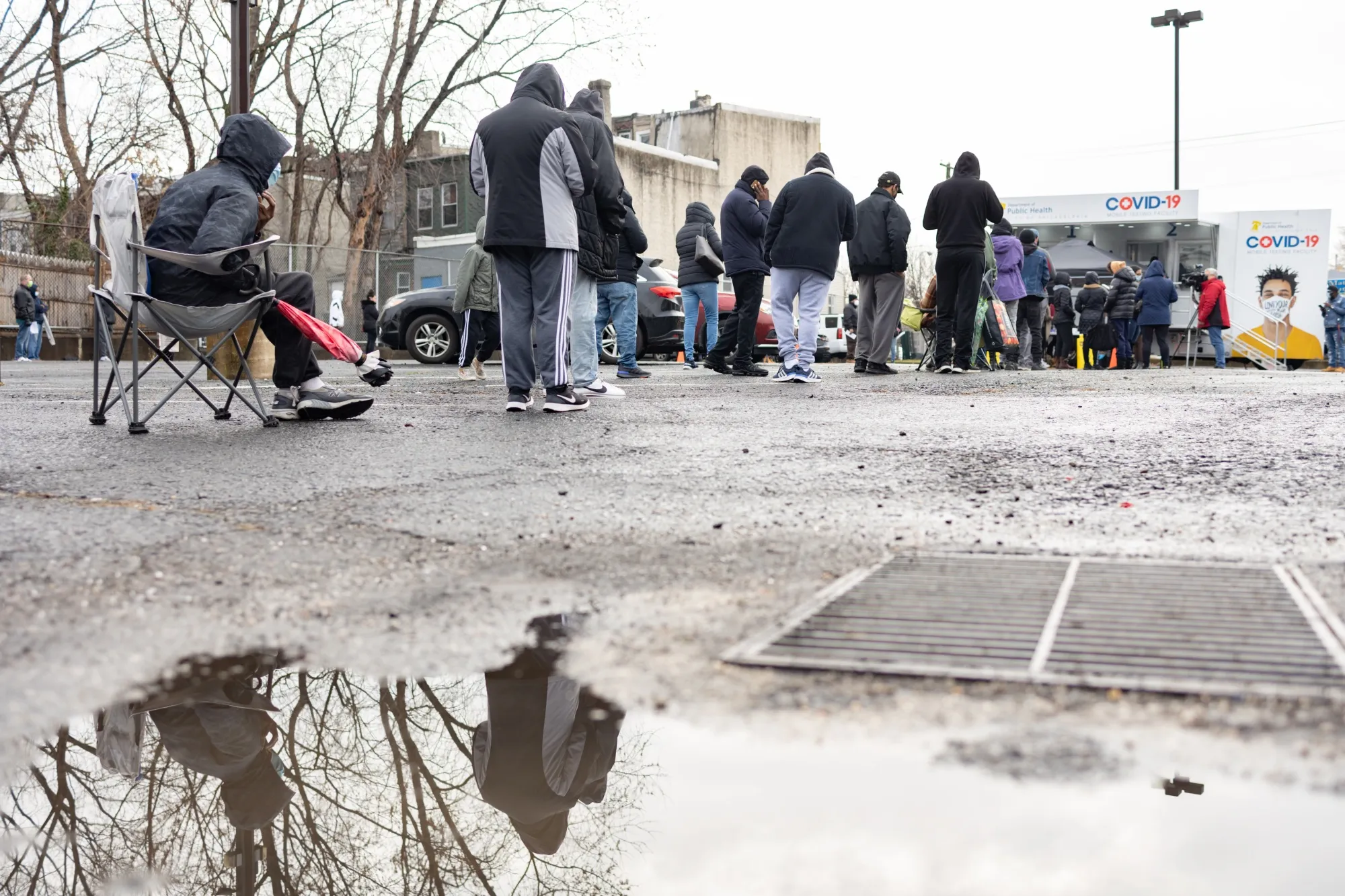 Residents wait in line to receive a Covid-19 test at a Philadelphia Department of Public Health mobile testing site in Philadelphia, on Dec. 30.
