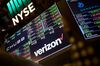 A monitor displays Verizon Communications Inc. signage on the floor of the New York Stock Exchange (NYSE) in New York, U.S., on Monday, March 12, 2018. Stocks gave up early gains Monday as uncertainty over the prospect of tariffs undid some of the market's recent job-driven gains.